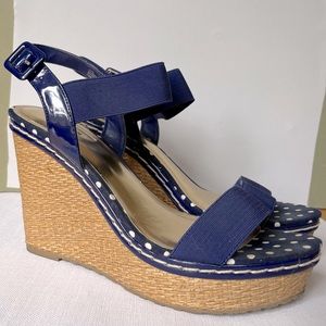 Sweet, navy polka dot wedge sandals.
